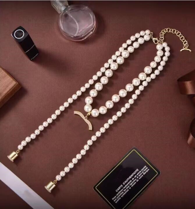 Eleganckie kobiety białe perłowe wisiorki z diamentami Naszyjki Dzielniło Naszyjnik Anti strat