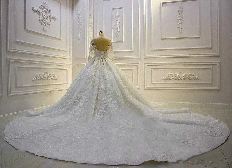 Скромное бальное платье с длинными рукавами Свадебные платья Свадебные платья Прозрачная шея с драгоценными камнями Кружева с аппликациями и блестками Плюс размер Robe De Mariee на заказ
