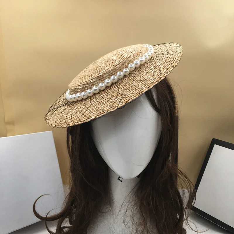 Szerokie brzegowe czapki wiadra czapki trawy damskie Pearl Mesh dekoracja prosta kapelusz retro modne plażowe słońce w kolorze damskim letni kapelusz elegancki szeroki brązowy kapelusz J240305