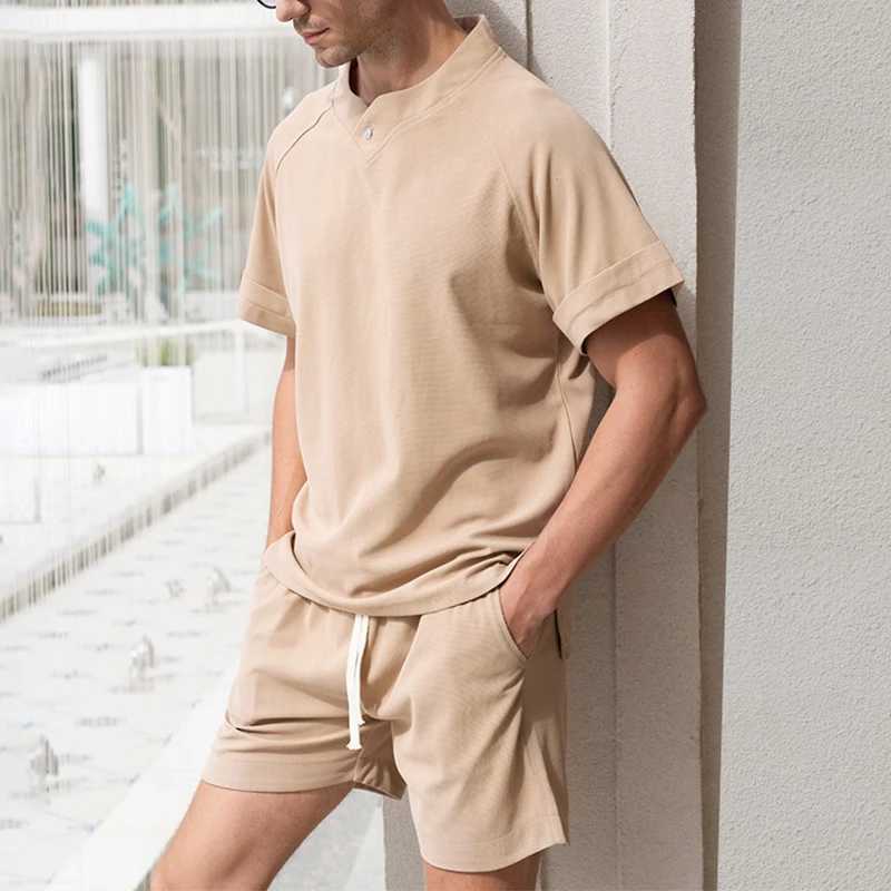 Men's Tracksuits New casual solid color waffle two-piece set for mens summer standing collar short sleeved T-shirt and shorts mens fashion set J240305