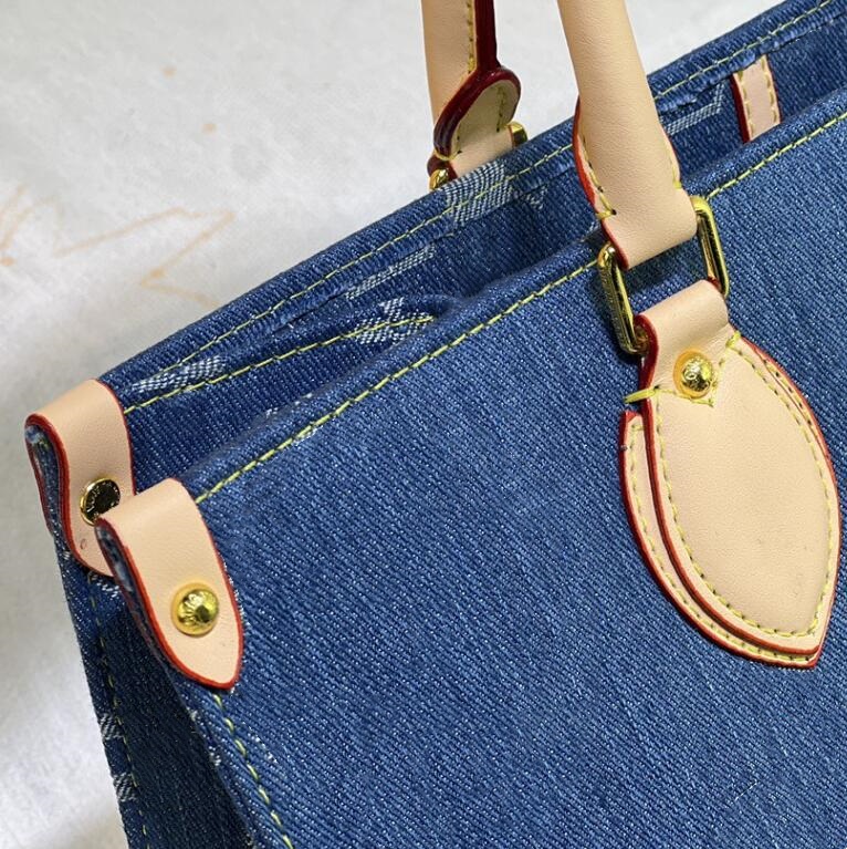 Kvinnors designer handväskor stor kapacitet denim gamla blommor tygväskor topp äkta läder rem crossbody axelblå shoppingväskor dagliga outfit