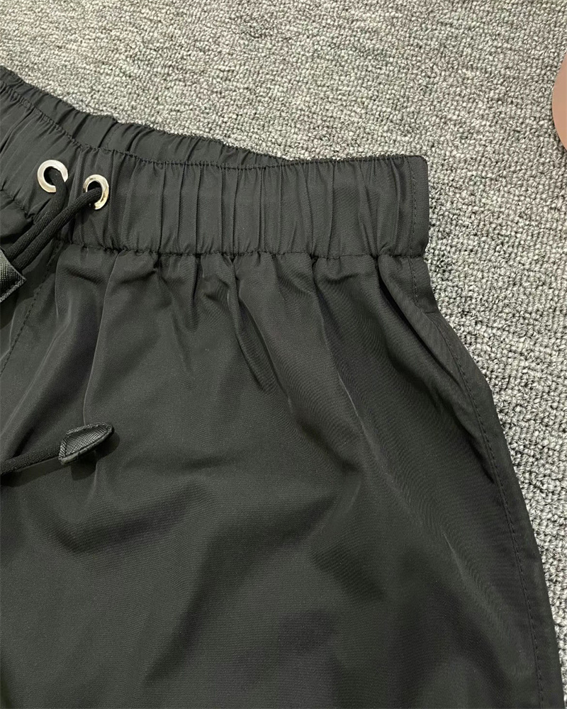 Nuovi pantaloncini in PU da donna con tasca triangolare con cerniera di marca elasticizzata a vita alta con pantaloni con lettera i