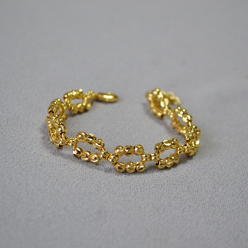 Design di nicchia europeo e americano ottone placcatura in oro lucido lotto fiore laser perline tessitura braccialetto di temperamento sensoriale di moda con perline di alto livello
