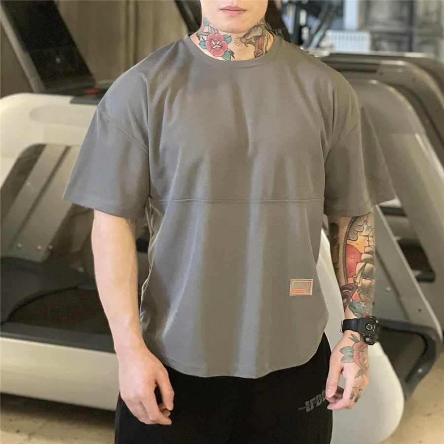 Camisetas para hombres 2021 Mens Muscle T Shirt Culturismo Fitness Hombres Tops Algodón Singlets Plus Tamaño grande Camiseta Algodón Malla suelta Manga corta