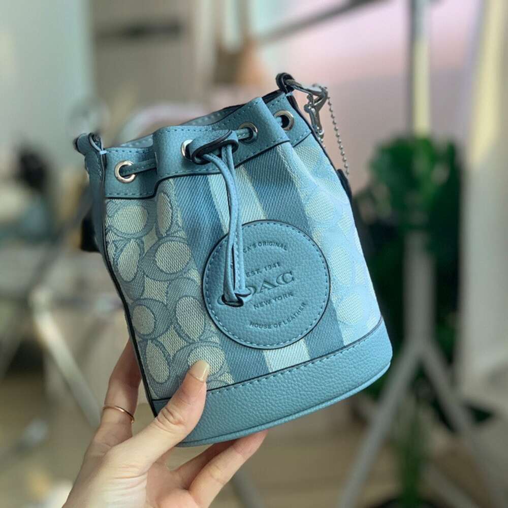 Venda por atacado de fábrica 2024 nova bolsa feminina série Dempsey balde com cordão mini bolsa crossbody de um ombro