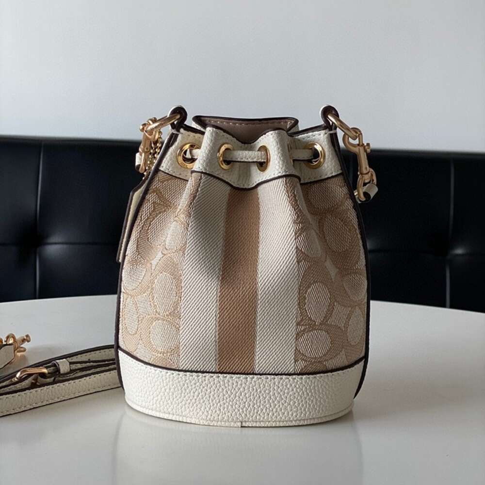 Venda por atacado de fábrica 2024 nova bolsa feminina série Dempsey balde com cordão mini bolsa crossbody de um ombro