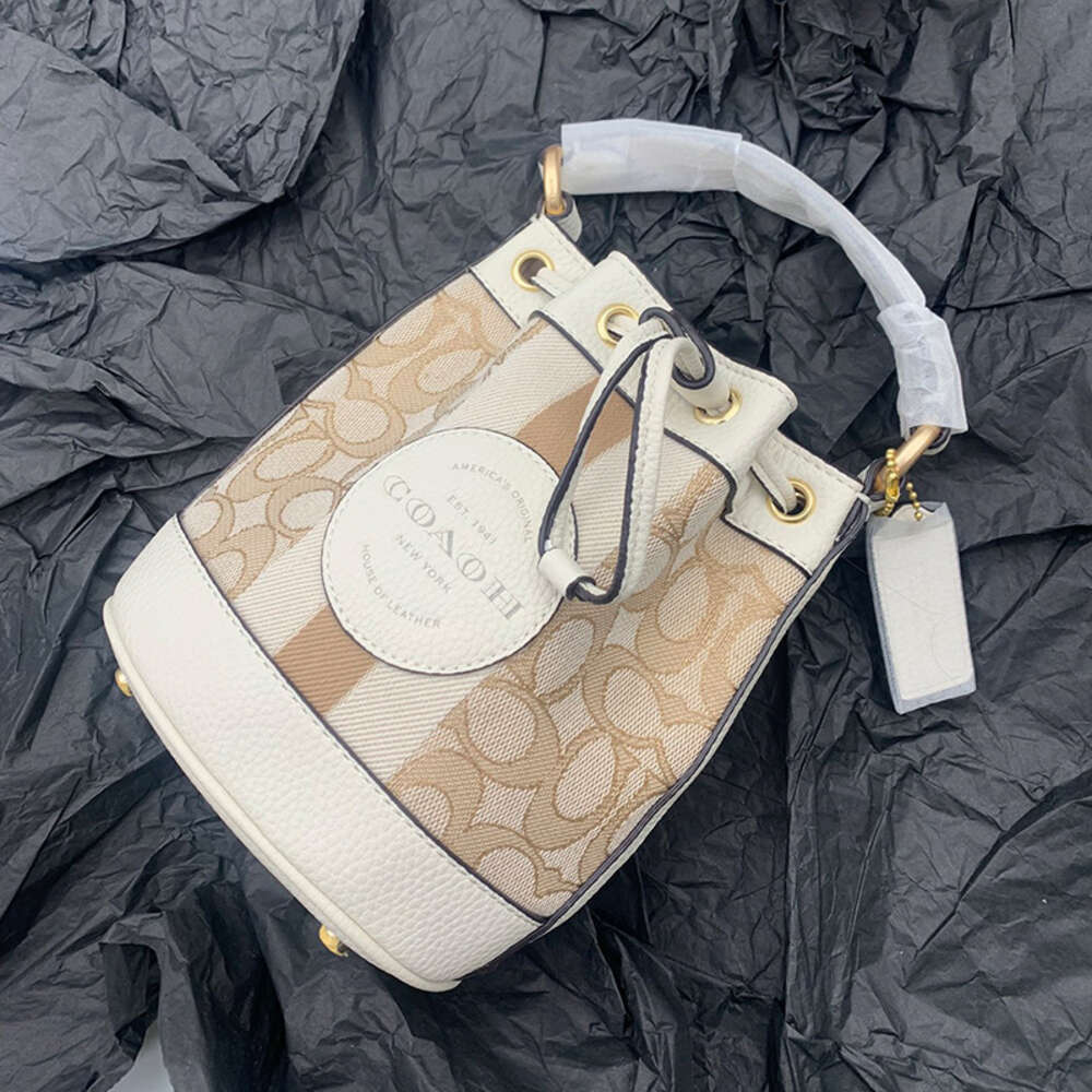 Dempsey – sac seau Macaron Jacquard rond en toile avec cordon de serrage, sacoche asymétrique épaule dénudée, vente en gros d'usine, nouvelle collection 2024