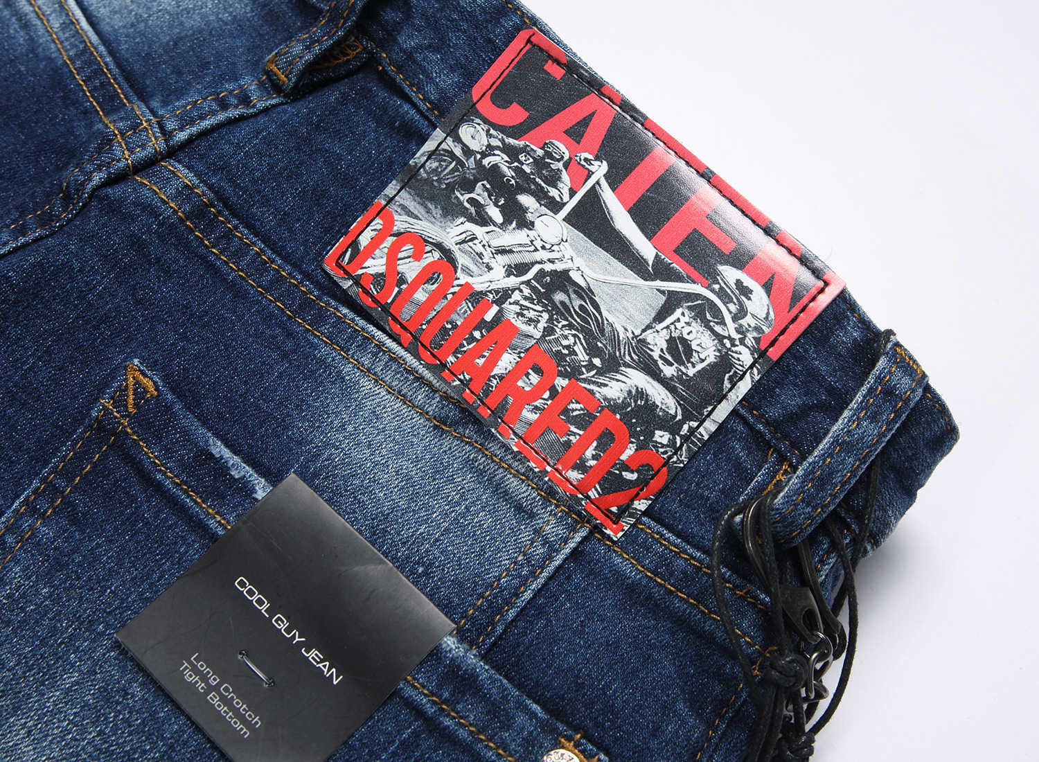 Jeans da uomo firmati Marchio alla moda Toppe in difficoltà Linee colorate disordinate Stampate Piccolo tubo dritto Vita media High Street Casual e alla moda uomo