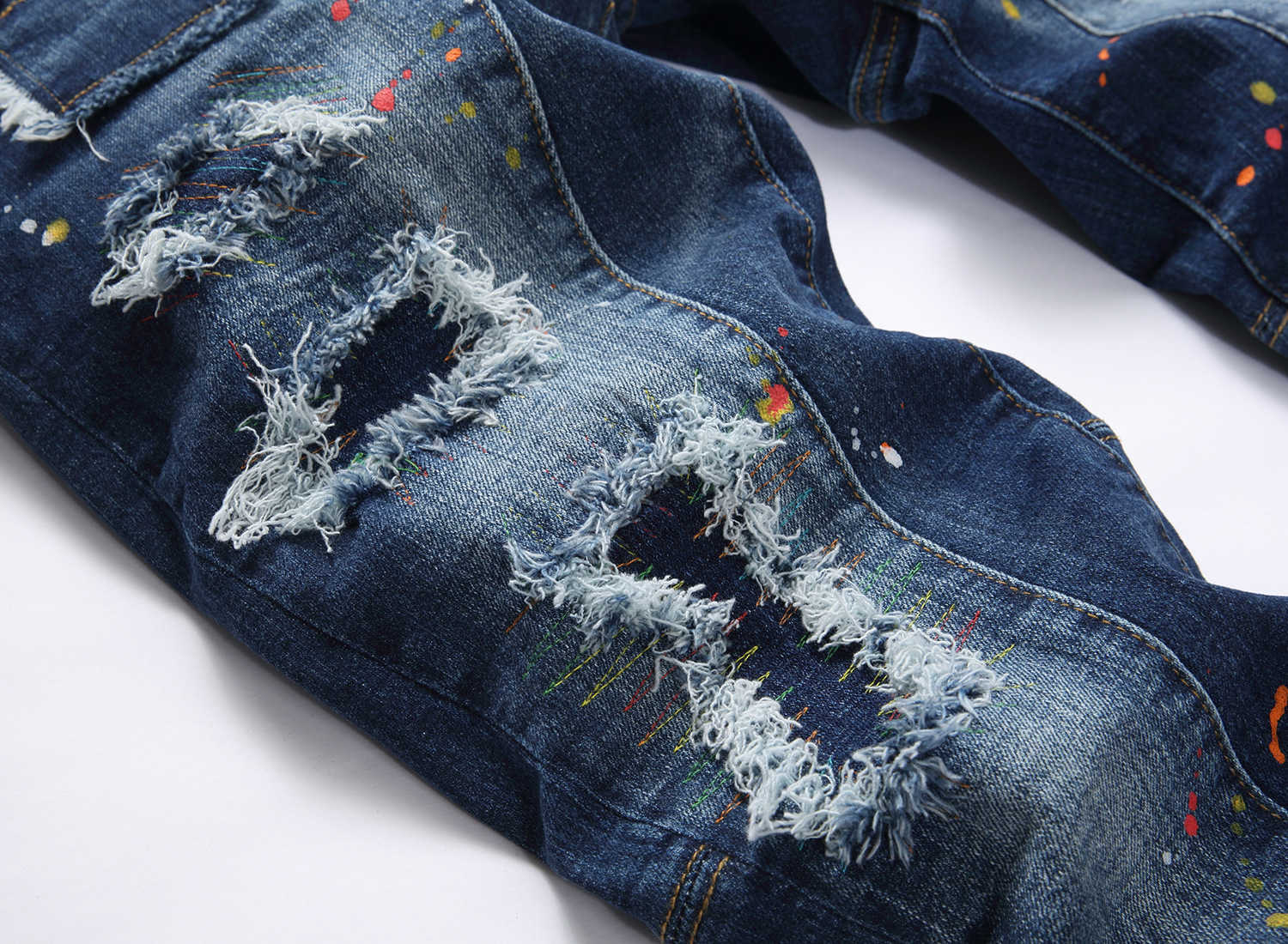 Jeans da uomo firmati Marchio alla moda Toppe in difficoltà Linee colorate disordinate Stampate Piccolo tubo dritto Vita media High Street Casual e alla moda uomo