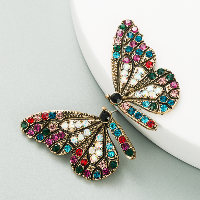 Style européen et américain personnalité design ailes de papillon couleur diamant série boucles d'oreilles alliage incrusté jolie fille coeur boucle d'oreille décoration d'oreille