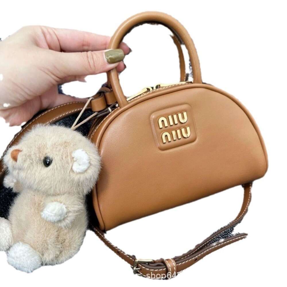 Günstiger Großhandel, begrenzter Ausverkauf, 50 % Rabatt, Handtasche New Home Bowling Handheld Gold Label Dumpling Single Shoulder Skew Straddle Bag