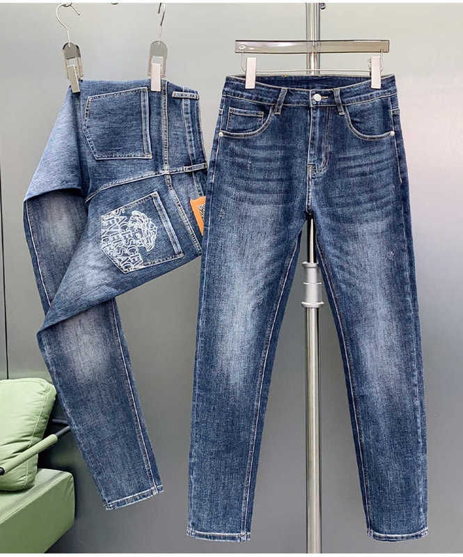 Jeans da uomo firmati Jeans da uomo lavati stagionali stampati con testa di bellezza europea di alta qualità versatili pantaloni a gamba dritta elasticizzati slim fit FMSZ