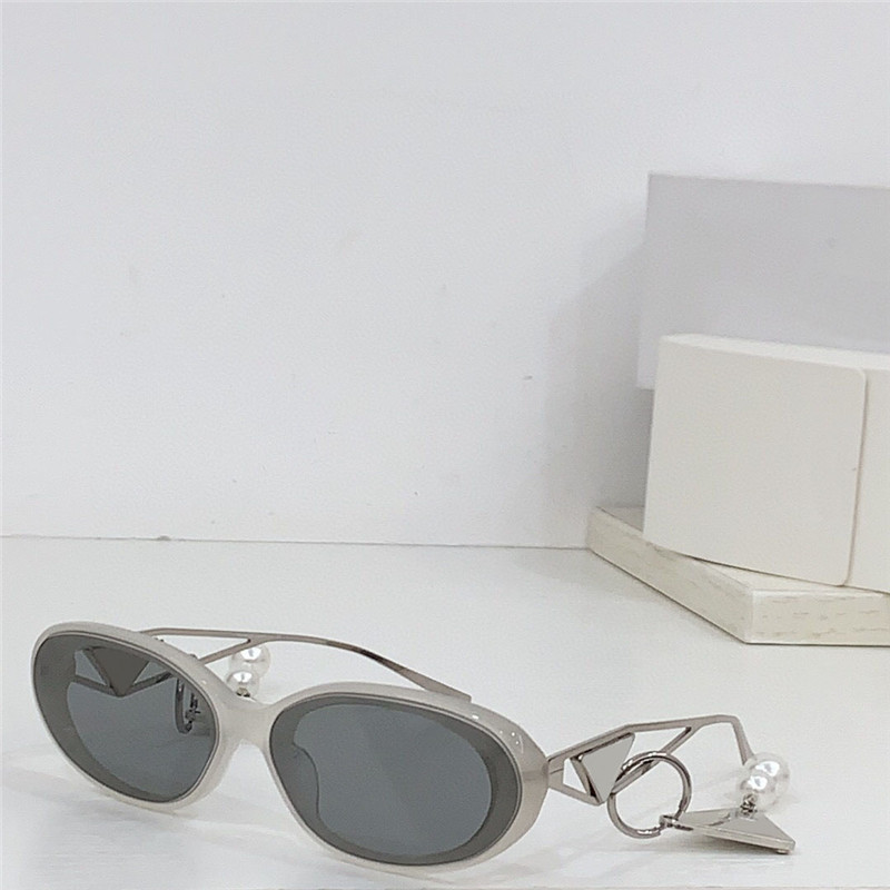 Occhiali da sole ovali piccoli di nuovo design alla moda 62WS aste in metallo con montatura in acetato occhiali di protezione UV400 esterni stile semplice e popolare con ciondolo squisito