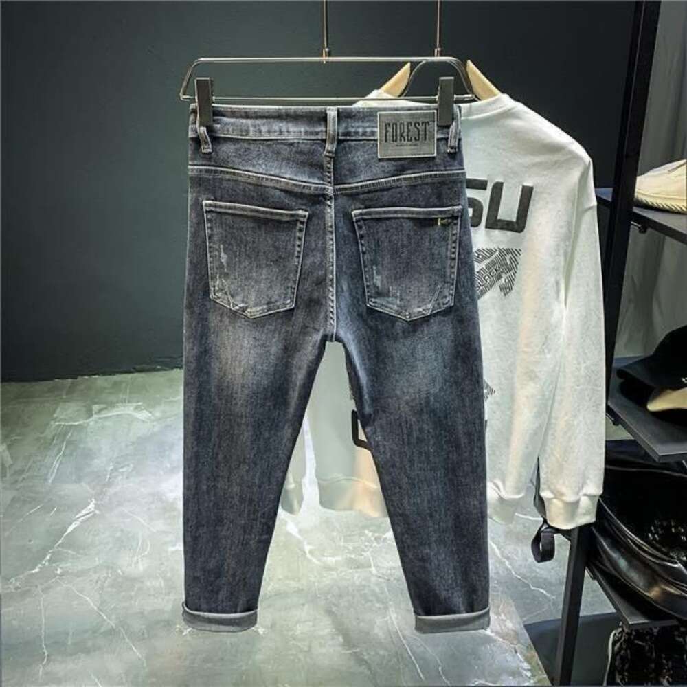 Jeans de créateur Nouveaux jeans haut de gamme pour hommes Pantalons à petites jambes extensibles coréens pour hommes Pantalons courts amincissants décontractés et polyvalents pour hommes