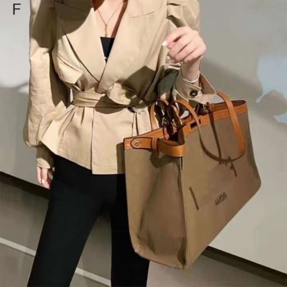 Handväska designer Ny solsken handhållen tygpåse stor kapacitet kvinnor dubbel hand handtag äkta läder en axel ljus lyx