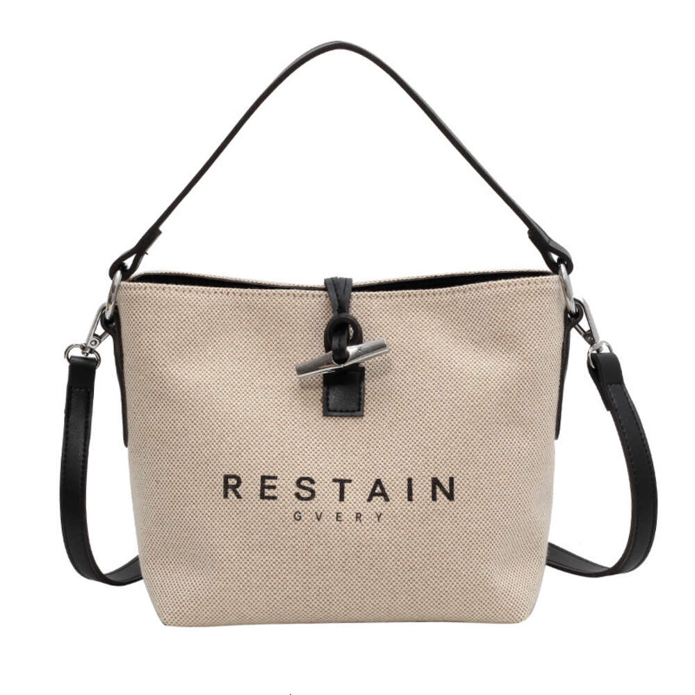 Factory Source High Quality Handbags Is 2024 Fashion Personality Daily Commuter Canvas Letter Printing Cow Horn Buckle Simple Bag One Shoulder Crossbody