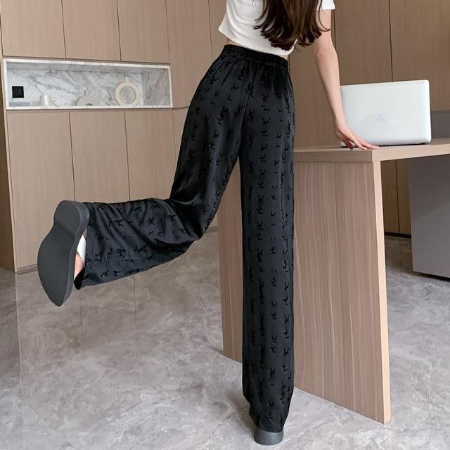 Pantaloni lunghi a gamba larga da donna con logo in vita elasticizzato alto floccato colore nero SMLXLXXL