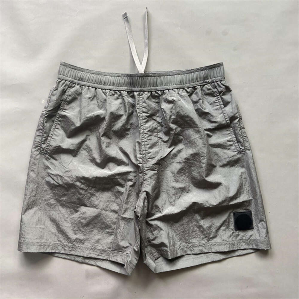 Nya klassiska mäns utomhus Casual Löst montering Snabbtorkande metall Nylon 5 Point med trendiga märkeshorts