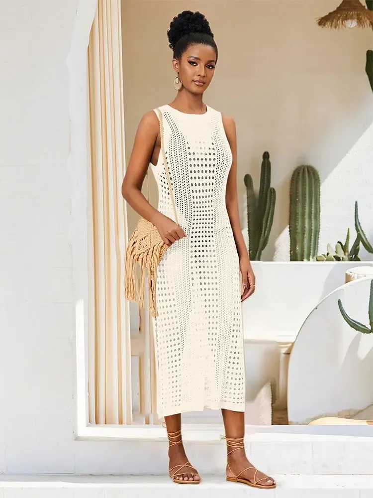 Abiti casual di base Crochet bianco Mesh senza maniche Patchwork Abito da spiaggia 2024 Summer Womens Sexy Hollow Knitted Beach Dress Q1513 Q240430