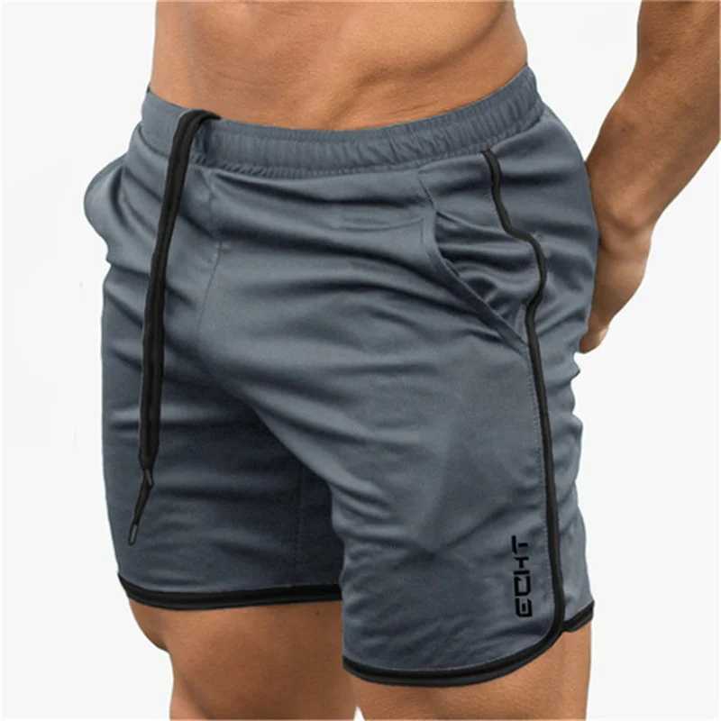 Shorts maschile uomini cortometraggi di fitness palestre estive allenamento maschio a maglie traspirabili a maglie a secco rapido jogger short pantaloni pantaloni uomini y240507394b