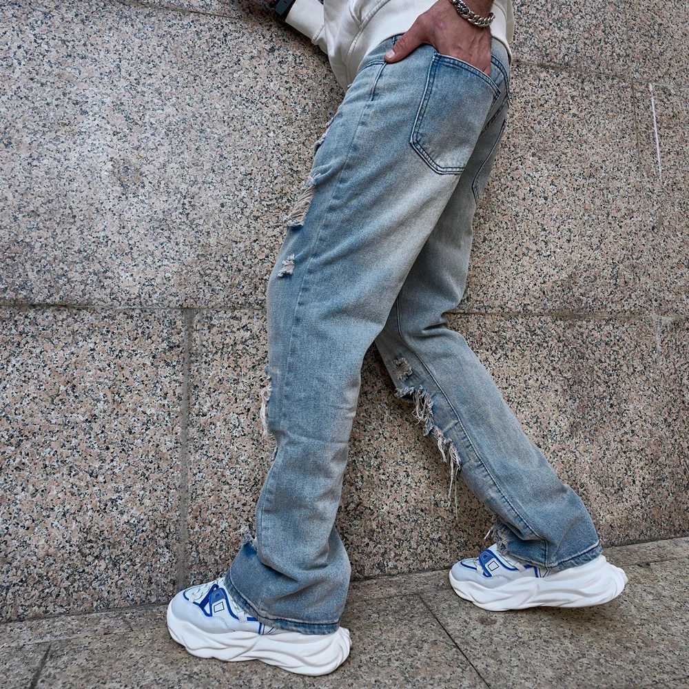 Jeans masculin élégant vintage lâche hommes jeans froide pantalon masculin hip hop trous masculin solide moto pantalon denim décontracté y240507