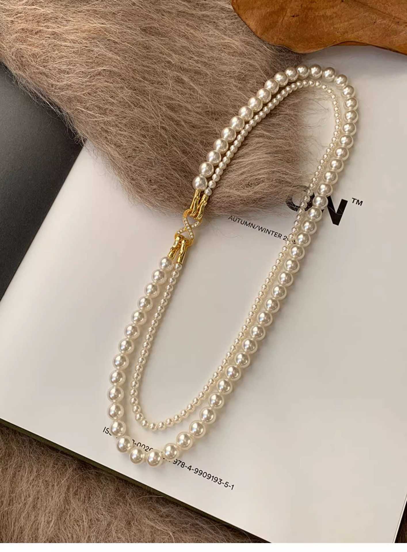 Double layered round bright pearl necklace niche stacked sweater chain light luxury neck chain detachable new style