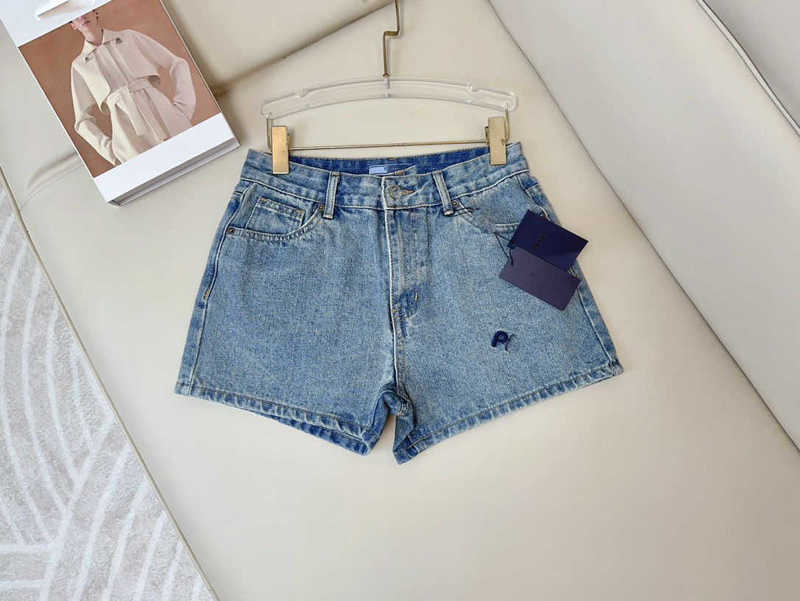 Marque de créateurs de shorts pour femmes printemps et été nouveau PRA style littéraire micro-élastique coton pure fashion petite foule haute taille denim 11sv