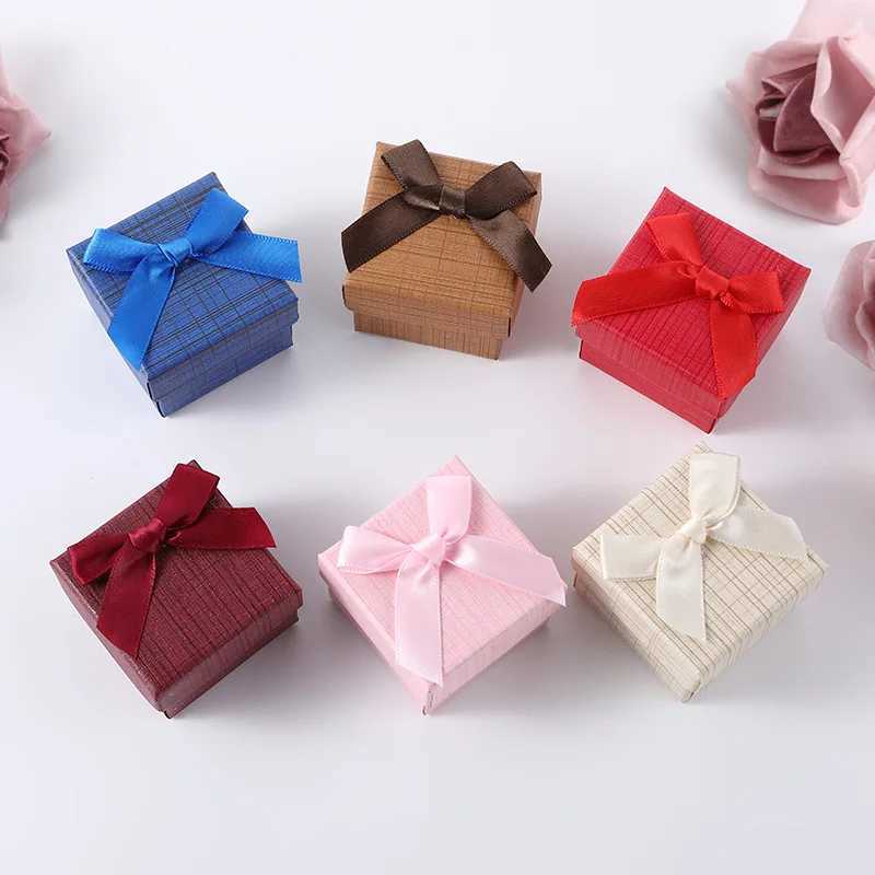 Boîtes de bijoux Boîte de bijoux en gros de Bowknot pour boucles d'oreilles Collier d'anneau cadeau de mariage Boîte de mariage Solid Color Cardboard Boîte d'emballage de bijoux