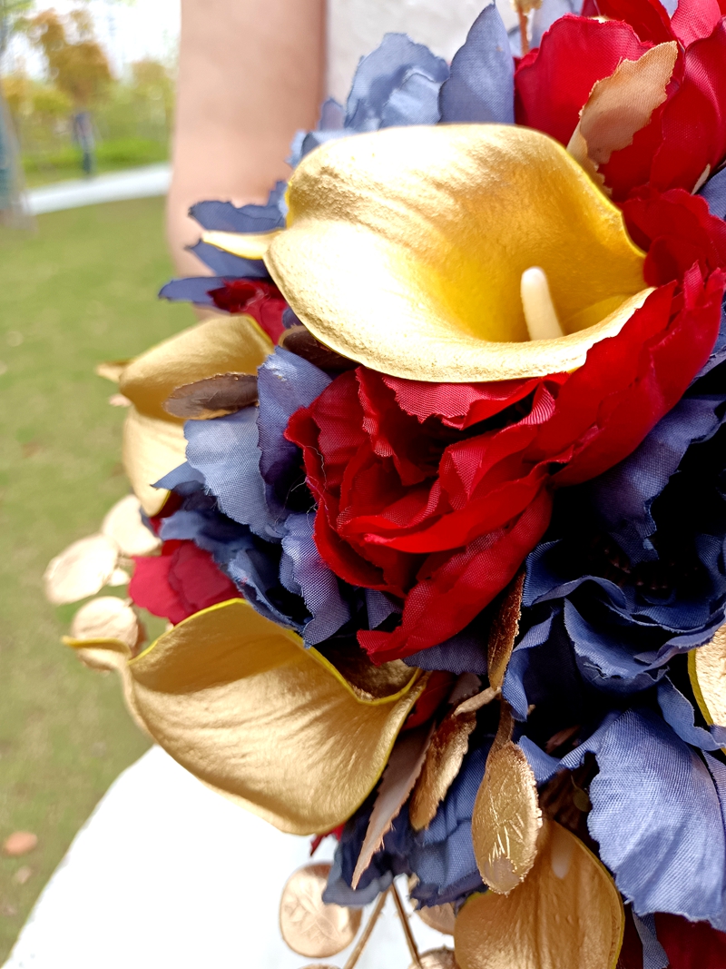 Red roses, purple roses, golden calla lily combination wedding bouquet