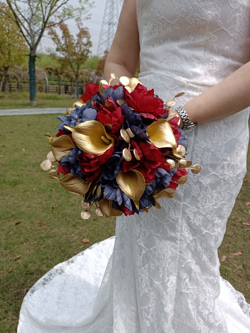 Red roses, purple roses, golden calla lily combination wedding bouquet