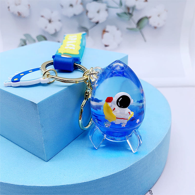 Acrylic oil in space astronaut rocket floating bottle keychain exquisite quicksand pendant couple bag pendant