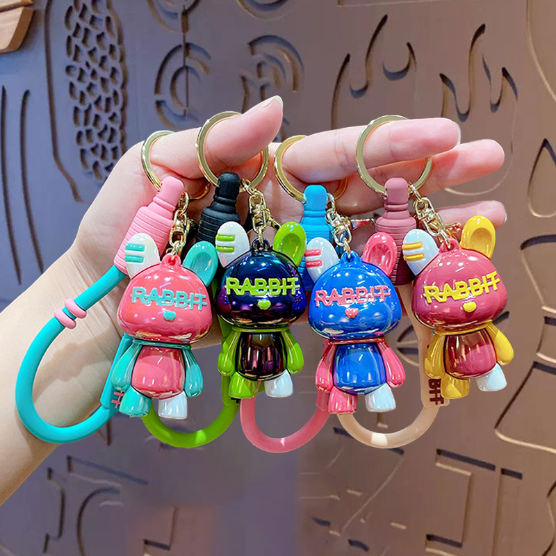 Paar farbiger cooler Keychain kreative Buchbeutel Anhänger Puppenjunge Auto Schlüsselanhänger kleiner Geschenkgroßhandel