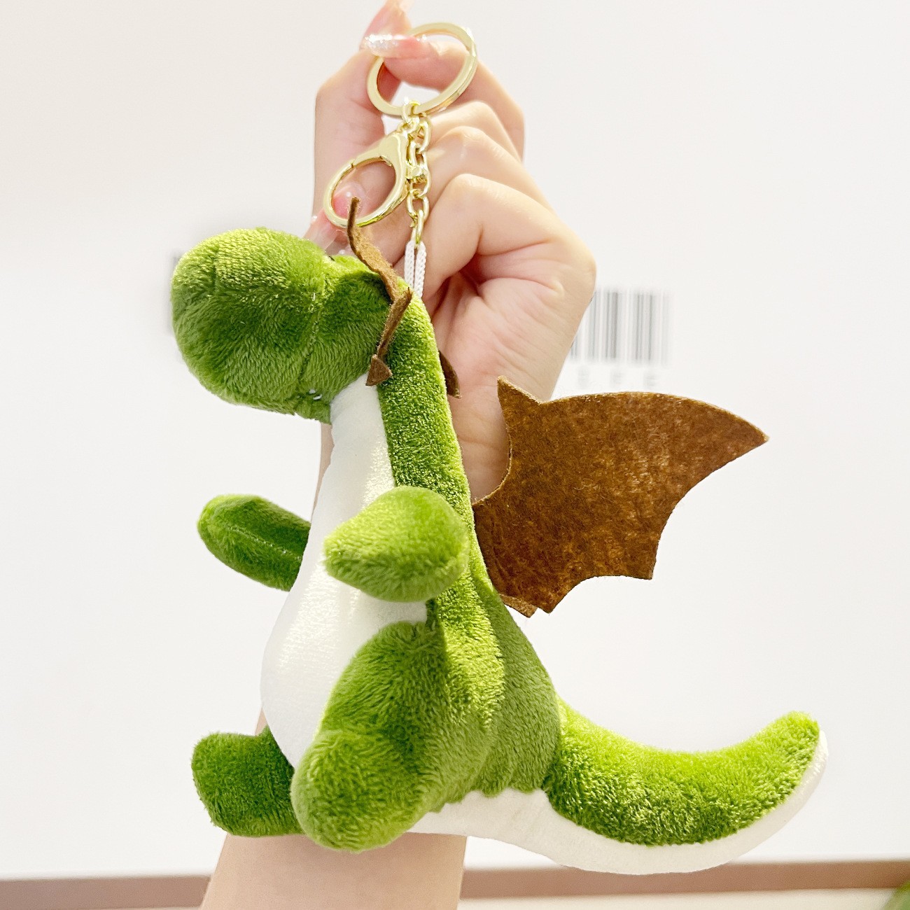Creatieve pluche dinosaurus sleutelhanger, schattige pop, poppenhanger, grijpmachine speelgoed, boekentas, hangende decoratie, groothandel in kleine geschenken