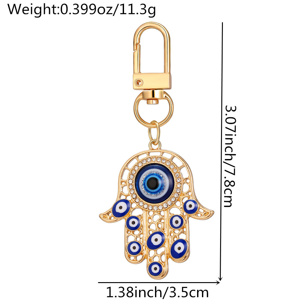 Blue Evil Eye Keychain alliage Righestone Palm Palle Pendre Key Ring Femmes Men Colorful Hollow Moon Coeur Charmes Lobster Backle Sac Car Clé ACCESSOIRES