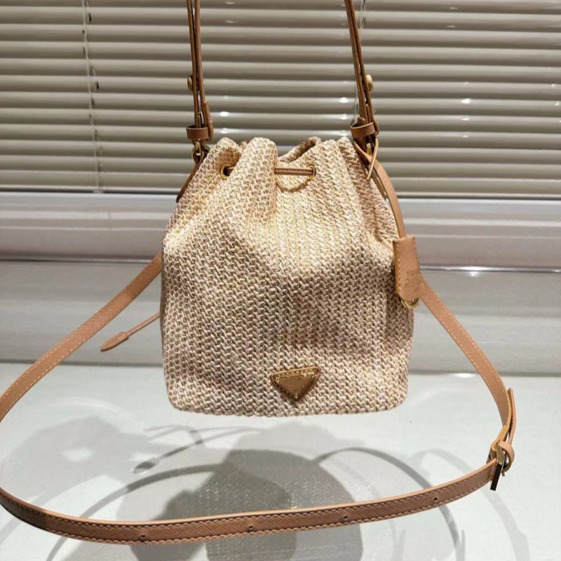 High-end designer bag bucket bag leisure straw woven material leisure sports bag can be carried across the body 