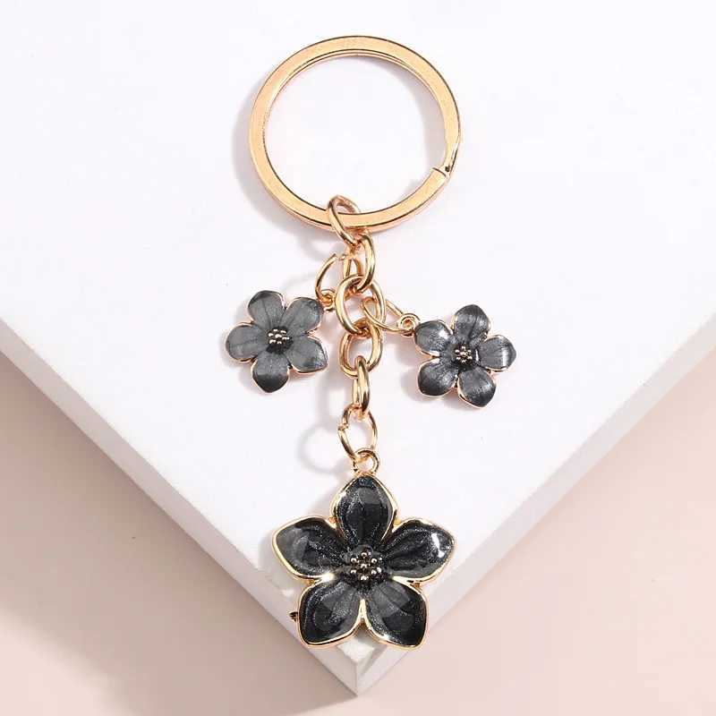 Keychains Lanyards mignon plante Keychain Sakura Flower Key Ring Ematel Chains For Women Girls sac à main Accessoire Car clés de voiture diy Douces bijoux cadeaux Q240403