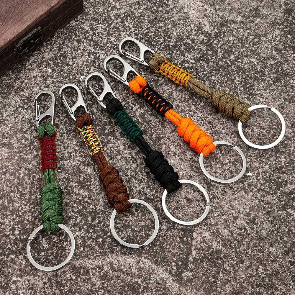 Keychains Lanyards MKENDN Double Chain Keychain Mens Handmade Weaving Outdoor Climbing Umbrella Rope Snake Knot Emergency Metal Keyring Q240403