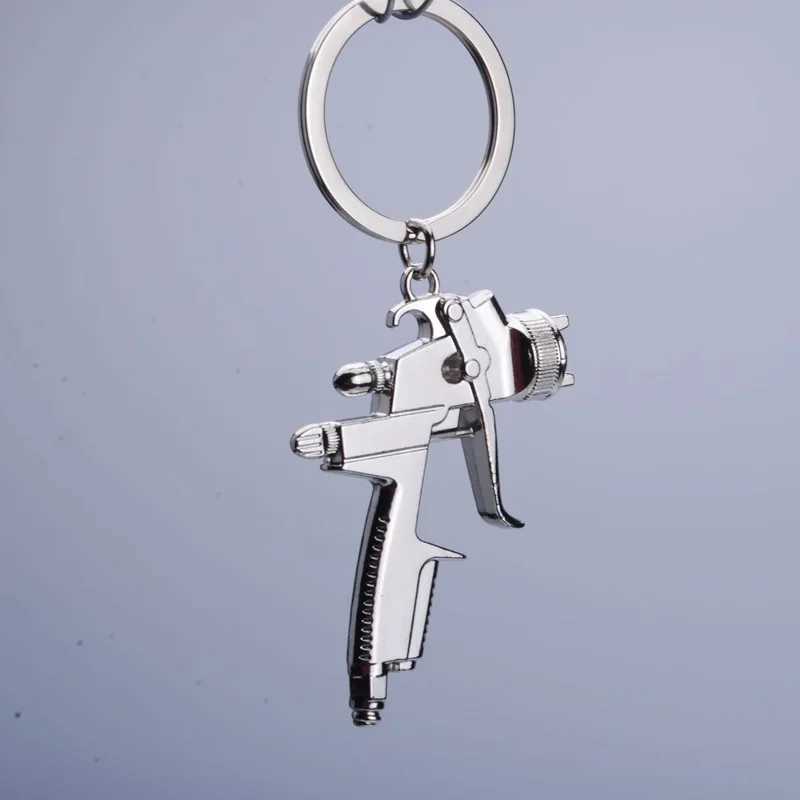 Nyckelringar Lanyards Metal Ny vattenpistolnyckeltröjor Biltvättverktyg Högtrycksvatten Gun Model Key Chain Party Gift Pendant Key Ring K2011 Q240403