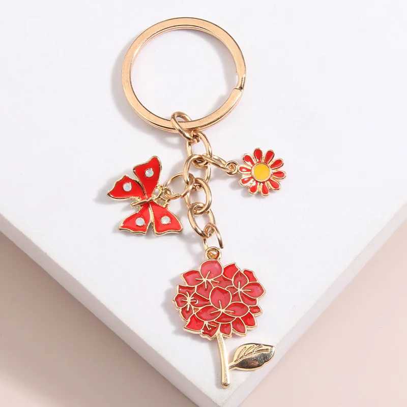 Keychains Lanyards Söta emalj Nyckelring Butterfly Flower Sun Honeybee Key Ring Heart Pearl Chains Trädgårdsgåvor för kvinnor Män handgjorda smycken Q240403