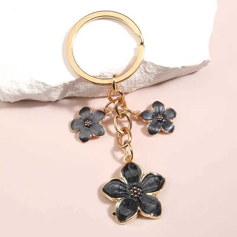 Keychains Lanyards mignon plante Keychain Sakura Flower Key Ring Ematel Chains For Women Girls sac à main Accessoire Car clés de voiture diy Douces bijoux cadeaux Q240403