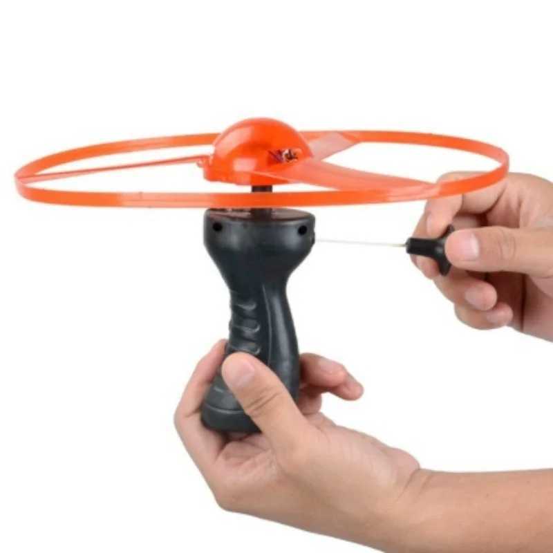 LED Flying Toys Funny Spinning Flyer Luminous Flying UFO LED Light Handle Flash Toys for Kids Outdoor Game Color Random 240410