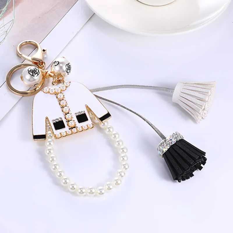 Belangrijkste ringen Luxurymerk Trendy Rhinestone Pearl Tassel Suit hanger Keychain Exquisite Women Bag Jewelry Accessoires Girl 240412