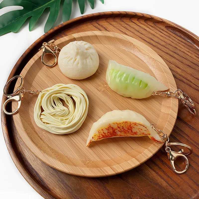 Chaços de chaves da simulação de alimentos colchas de bolinhos de alimentos baozi macarrão pvc mini -chave cozida jiaozi brinquedos mochila backpack ornament presente por atacado