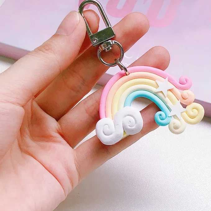 Keychains Lanyards New Lovely Cute Rainbow Key Chain Leather Strap Braided Rope Tassel Keychain for Women Girl Bell Star Lollipop Bag Accessories d240417