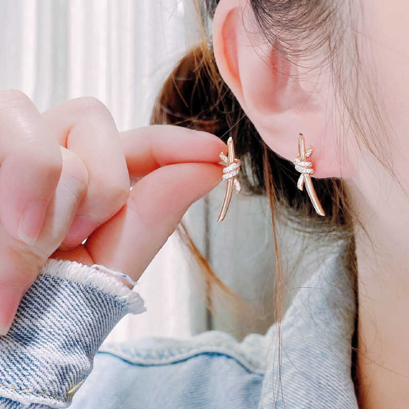 Boucles d'oreilles nouées de sophistication designer Sophistication Tiffayss