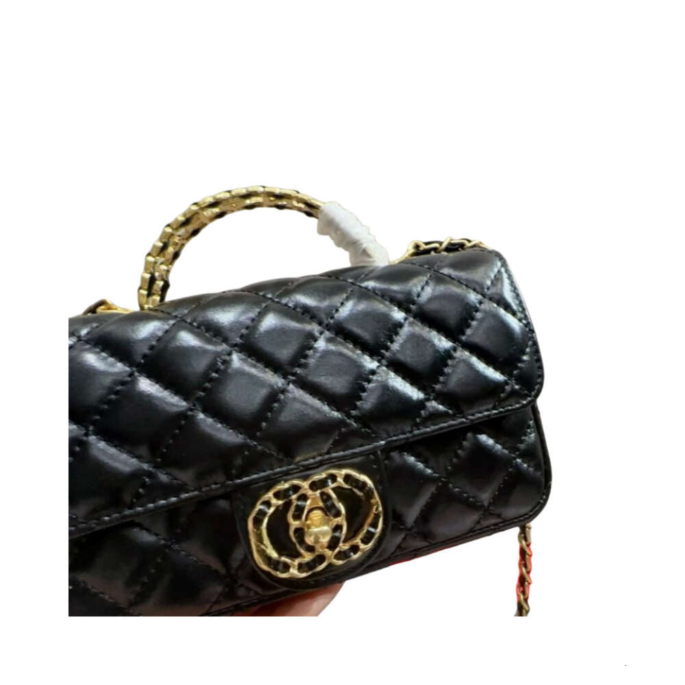 Winkels verkopen hoogwaardige handtassen met ontwerpontwerpen lederen mini -tas vrouwelijke lingge ketting net rood kleine gouden bal een schoudergesp.