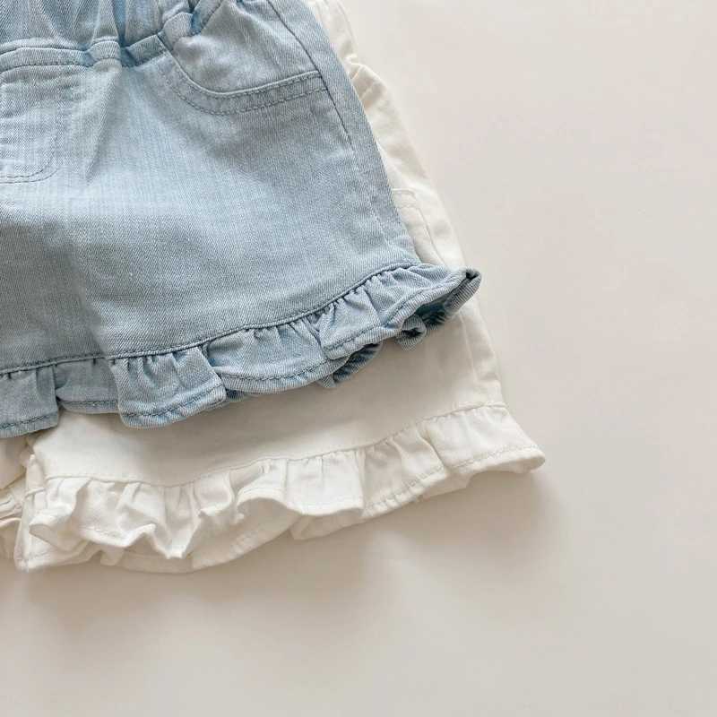 Shorts barns nya sommarbarn och flickor ruffle shorts solida kort denim barn och flickor jeans H240425