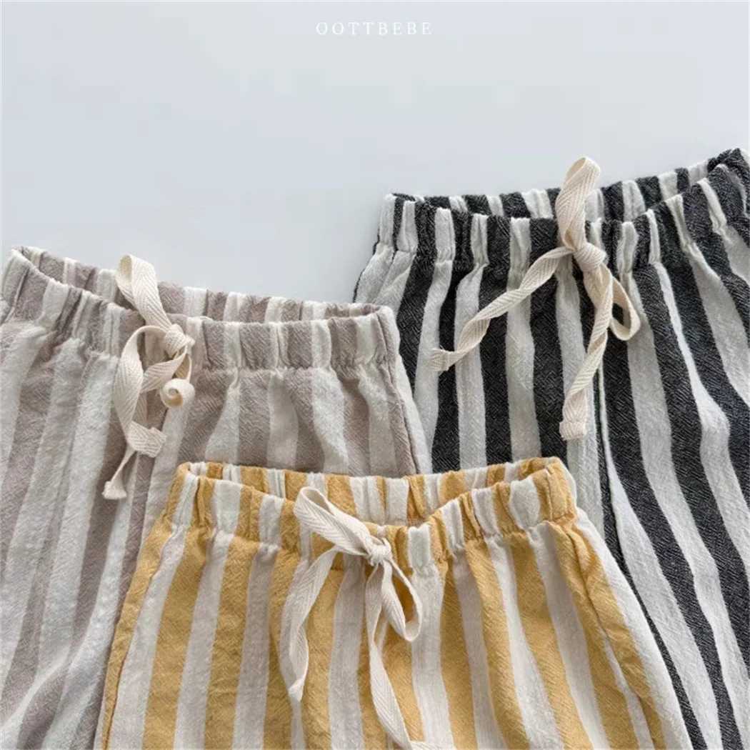 Pantalones pantalones de algodón de lino vintage para niños diseño de bolsillo casual pantalones de cintura para niñas para niños niños niños pantalones H240425