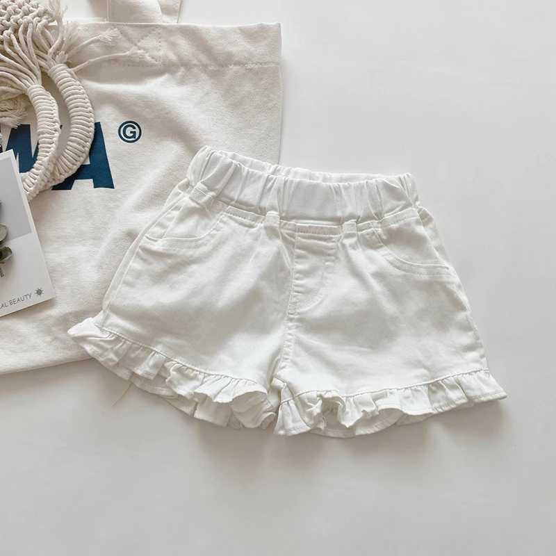 Shorts barns nya sommarbarn och flickor ruffle shorts solida kort denim barn och flickor jeans H240425