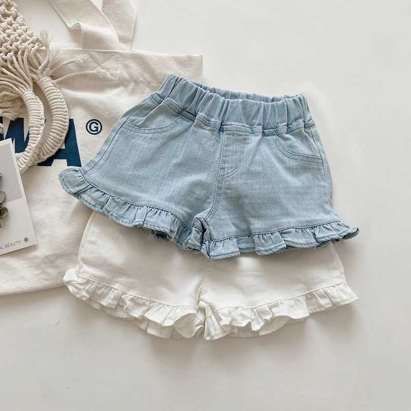 Shorts barns nya sommarbarn och flickor ruffle shorts solida kort denim barn och flickor jeans H240425